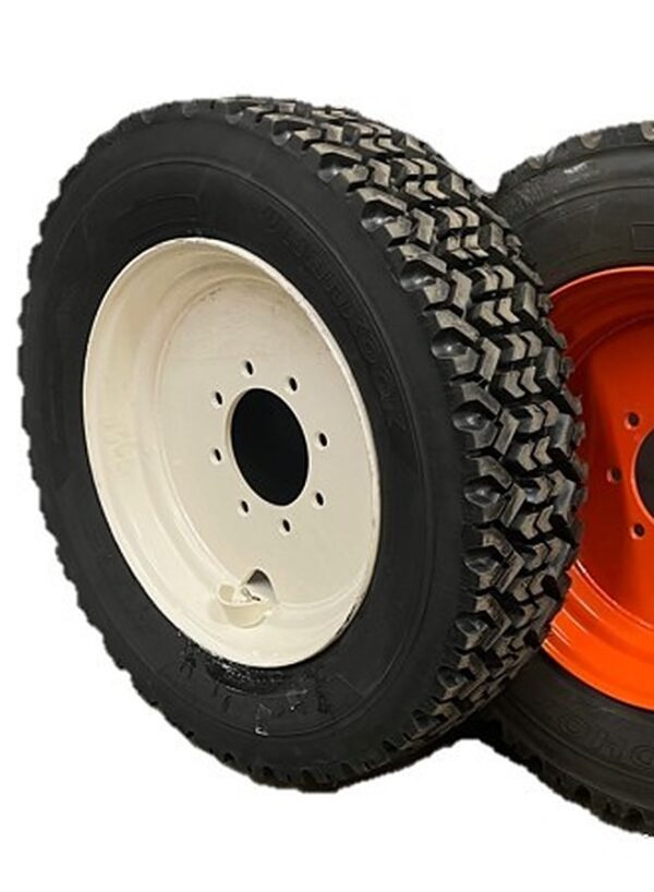 Snow tire mounted on a cream 8-lug skid steer wheel
