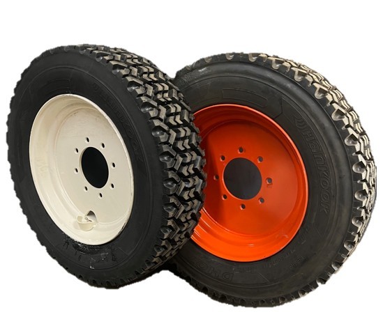 Mounted skid steer snow tire kit